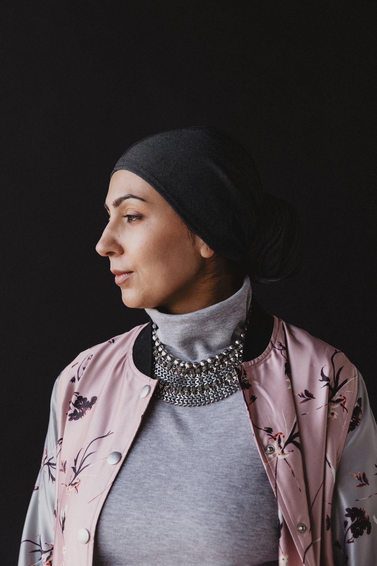 Woman poses in dark room